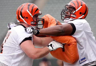 CINCINNATI, OH - MAY 1:  First round draft pick Andre Smith #7 (R) of the Cincinnati Bengals battles with teammate Ryan Madison #61 during rookie minicamp at Paul Brown Stadium on May 1, 2009 in Cincinnati, Ohio.  (Photo by Mark Lyons/Getty Images)
