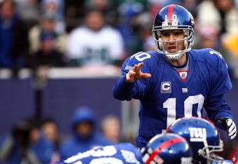 EAST RUTHERFORD, NJ - JANUARY 11:  Eli Manning #10 of the New York Giants gestures against the Philadelphia Eagles during the NFC Divisional Playoff Game on January 11, 2009 at Giants Stadium in East Rutherford, New Jersey.  (Photo by Al Bello/Getty Images)