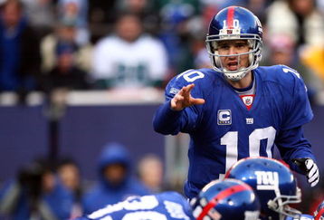 EAST RUTHERFORD, NJ - JANUARY 11:  Eli Manning #10 of the New York Giants gestures against the Philadelphia Eagles during the NFC Divisional Playoff Game on January 11, 2009 at Giants Stadium in East Rutherford, New Jersey.  (Photo by Al Bello/Getty Images)