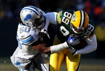 GREEN BAY, WI - DECEMBER 28: Ernie Sims #50 of the Detroit Lions brings down James Jones #89 of the Green Bay Packers on December 28, 2008 at Lambeau Field in Green Bay, Wisconsin. The Packers defeated the Lions 31-21. (Photo by Jonathan Daniel/Getty Images)