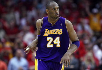 HOUSTON - MAY 08:  Guard Kobe Bryant #24 of the Los Angeles Lakers reacts after making a three-point shot against the Houston Rockets in Game Three of the Western Conference Semifinals during the 2009 NBA Playoffs at Toyota Center on May 8, 2009 in Houston, Texas. NOTE TO USER: User expressly acknowledges and agrees that, by downloading and or using this photograph, User is consenting to the terms and conditions of the Getty Images License Agreement.  (Photo by Ronald Martinez/Getty Images)