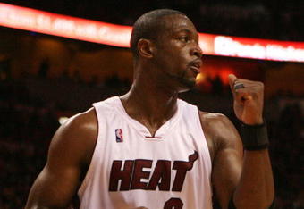 MIAMI - MAY 01:  Dwyane Wade #3 of the Miami Heat pumps his fist after the heat get a stop in the fourth quarter against the Atlanta Hawks during Game Six of the Eastern Conference Quarterfinals at American Airlines Arena on May 1, 2009 in Miami, Florida. The Heat defeated the Hawks 98-72. NOTE TO USER: User expressly acknowledges and agrees that, by downloading and/or using this Photograph, user is consenting to the terms and conditions of the Getty Images License Agreement.  (Photo by Doug Benc/Getty Images)