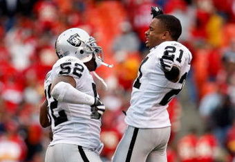 KANSAS CITY, MO - SEPTEMBER 14: Linebacker Kirk Morrison #52 of the Oakland Raiders is congratulated by Nnamdi Asomugha #21 after intercepting a pass late in the 4th quarter during the game on September 14, 2008 at Arrowhead Stadium in Kansas City, Missouri.  (Photo by Jamie Squire/Getty Images)