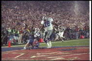 31 Jan 1993: Wide receiver Don Beebe of the Buffalo Bills (left) forces a fumble on defensive tackle Leon Lett of the Dallas Cowboys during Super Bowl XXVII at the Rose Bowl in Pasadena, California. The Cowboys won the game, 52-17.