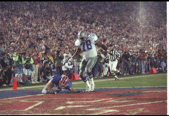 31 Jan 1993: Wide receiver Don Beebe of the Buffalo Bills (left) forces a fumble on defensive tackle Leon Lett of the Dallas Cowboys during Super Bowl XXVII at the Rose Bowl in Pasadena, California. The Cowboys won the game, 52-17.
