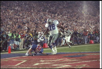 31 Jan 1993: Wide receiver Don Beebe of the Buffalo Bills (left) forces a fumble on defensive tackle Leon Lett of the Dallas Cowboys during Super Bowl XXVII at the Rose Bowl in Pasadena, California. The Cowboys won the game, 52-17.