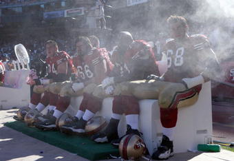 SAN FRANCISCO - OCTOBER 07: Joe Staley #74, Eric Heitmann #66 Larry Allen #71 Adam Snyder #68 of the San Francisco 49ers cool off on the bench against the Baltimore Ravens during an NFL game on October 7, 2007 at Monster Park in San Francisco, California. (Photo by Jed Jacobsohn/Getty Images)