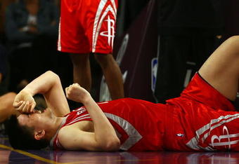 LOS ANGELES, CA - MAY 04:  Yao Ming #11 of the Houston Rockets reacts in pain after injuring his knee in the fourth quarter against the Los Angeles Lakers in Game One of the Western Conference Semifinals during the 2009 NBA Playoffs at Staples Center on May 4, 2009 in Los Angeles, California. Ming returned to the game later in the quarter. NOTE TO USER: User expressly acknowledges and agrees that, by downloading and or using this photograph, User is consenting to the terms and conditions of the Getty Images License Agreement.  (Photo by Jeff Gross/Getty Images)