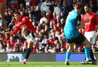 MANCHESTER, ENGLAND - APRIL 05:  Cristiano Ronaldo of Manchester United scores the opening goal during the Barclays Premier League match between Manchester United and Aston Villa at Old Trafford on April 5, 2009 in Manchester, England.  (Photo by Ryan Pierse/Getty Images)