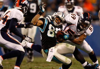 CHARLOTTE, NC - DECEMBER 14:  Wesley Woodyard #59 of the Denver Broncos tackles Steve Smith #89 of the Carolina Panthers during their game at Bank of America Stadium on December 14, 2008 in Charlotte, North Carolina  (Photo by Streeter Lecka/Getty Images)