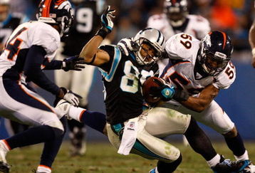 CHARLOTTE, NC - DECEMBER 14:  Wesley Woodyard #59 of the Denver Broncos tackles Steve Smith #89 of the Carolina Panthers during their game at Bank of America Stadium on December 14, 2008 in Charlotte, North Carolina  (Photo by Streeter Lecka/Getty Images)