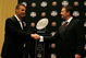 FORT LAUDERDALE, FL - JANUARY 07:  Head coach Urban Meyer of the Florida Gators and head coach Bob Stoops of the Oklahoma Sooners shake hands in front of 'The Coaches' Trophy' during the FedEx BCS Head Coaches Press Conference at Harbor Beach Marriott Resort & Spa on January 7, 2009 in Fort Lauderdale, Florida.  (Photo by Doug Benc/Getty Images)