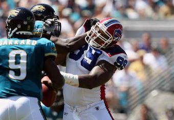 JACKSONVILLE, FL - SEPTEMBER 14:  Defensive tackle Marcus Stroud #99 of the Buffalo Bills tries to turn the corner and get to quarterback David Garrard #9 of the Jacksonville Jaguars at Jacksonville Municipal Stadium on September 14, 2008 in Jacksonville, Florida. The Bills defeated the Jaguars 20-16.  (Photo by Doug Benc/Getty Images)