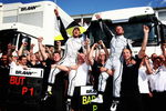 BARCELONA, SPAIN - MAY 10:  First placed Jenson Button (L) of Great Britain and Brawn GP and second placed Rubens Barrichello (R) of Brazil and Brawn GP celebrate in the paddock following the Spanish Formula One Grand Prix at the Circuit de Catalunya on May 10, 2009 in Barcelona, Spain.  (Photo by Clive Mason/Getty Images)