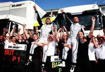 BARCELONA, SPAIN - MAY 10:  First placed Jenson Button (L) of Great Britain and Brawn GP and second placed Rubens Barrichello (R) of Brazil and Brawn GP celebrate in the paddock following the Spanish Formula One Grand Prix at the Circuit de Catalunya on May 10, 2009 in Barcelona, Spain.  (Photo by Clive Mason/Getty Images)