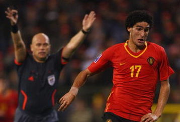 BRUSSELS, BELGIUM - OCTOBER 15:  FIFA referee Tom Henning Ovrebo from Norway plays advantage with Marouane Fellaini of Belgium in possession during the FIFA 2010 World Cup Group 5 Qualifier between Belgium and Spain at the King Baudouin Stadium on October 15, 2008 in Brussels, Belgium.  (Photo by Mike Hewitt/Getty Images)