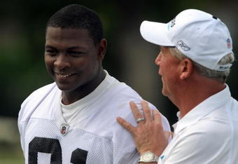 CHARLOTTE,NC- MAY 1: First round draft pick Everette Brown #91 of the Carolina Panthers smiles as Head Coach John Fox (R) pats him on the back as they walk off the field the minicamp practice at the team's practice facility on May 1, 2009 in Charlotte, North Carolina. (Photo by Steve Dykes/Getty Images)