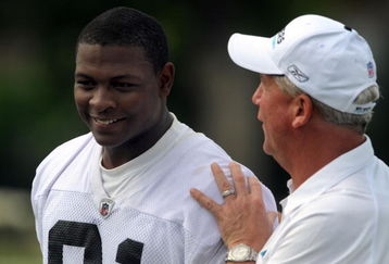 CHARLOTTE,NC- MAY 1: First round draft pick Everette Brown #91 of the Carolina Panthers smiles as Head Coach John Fox (R) pats him on the back as they walk off the field the minicamp practice at the team's practice facility on May 1, 2009 in Charlotte, North Carolina. (Photo by Steve Dykes/Getty Images)
