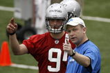 ALLEN PARK, MI - MAY 01:  Offensive coordinator Scott Linehan of the Detroit Lions talks with Matthew Stafford #9 during rookie orientation camp at the Detroit Lions Headquarters and Training Facility on May 1, 2009 in Allen Park, Michigan.  (Photo by Gregory Shamus/Getty Images)
