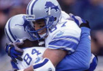24 Sep 2000:  Johnnie Morton #87 of the Detroit Lions hugs teammate Herman Moore #84 (R-L) in celebration during the game against the Chicago Bears at Soldier Field in Chicago, Illinois.  The Lions defeated the Bears 21-14.Mandatory Credit: Jonathan Daniel  /Allsport