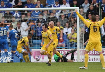GILLINGHAM, ENGLAND - MAY 10:  Chris Dagnall of Rochdale celebrates after scoring his team's first goal during the Coca Cola League Two Play-off Semi Final Second Leg between Gillingham and Rochdale at Priestfield Stadium on May 10, 2009 in Gillingham, England.  (Photo by Hamish Blair/Getty Images)