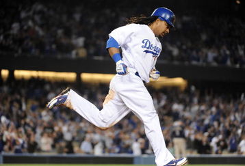 LOS ANGELES, CA - APRIL 30:  Manny Ramirez #99 of the Los Angeles Dodgers hits a homerun for a 4-3 lead against the San Diego Padres during the third inning at Dodger Stadium on April 30, 2009 in Los Angeles, California.  (Photo by Harry How/Getty Images)