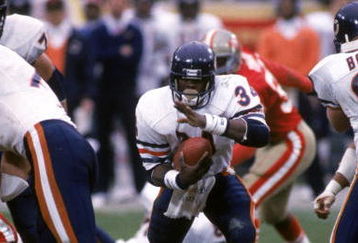 SAN FRANCISCO - JANUARY 6:  Running back Walter Payton #34 of the Chicago Bears runs with the ball during the 1984 NFC Championship Game against the San Francisco 49ers at Candlestick Park on January 6, 1985 in San Francisco, California.  The 49ers won 23-0  (Photo by George Rose/Getty Images)