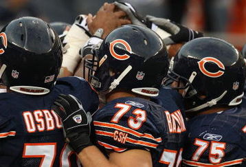 CHICAGO - AUGUST 21: Members of the Chicago Bear defense including Nick Osborn #79, Dan Bazuin #73 and Matt Toeaina #75 prepare to play against the San Francisco 49ers on August 21, 2008 at Soldier Field in Chicago, Illinois.The 49ers defeated the Bears 37-30.  (Photo by Jonathan Daniel/Getty Images)