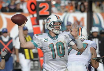 MIAMI, FL - JANUARY 4:  Quarterback Chad Pennington #10 of the Miami Dolphins sets to pass against the Baltimore Ravens in an NFL Wildcard Playoff Game at Dolphins Stadium on January 4, 2009 in Miami, Florida.  (Photo by Al Messerschmidt/Getty Images) 
