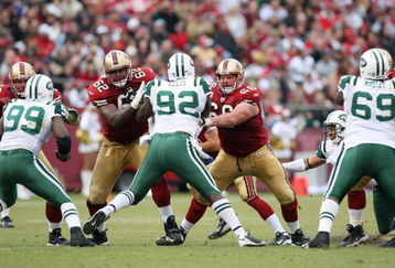 SAN FRANCISCO - DECEMBER 07:  Chilio Rachal #62 and Eric Heitmann #6 of the San Francisco 49ers blocks Shaun Ellis #92 of the New York Jets during an NFL game on December 7, 2008 at Candlestick Park in San Francisco, California. (Photo by Jed Jacobsohn/Getty Images)