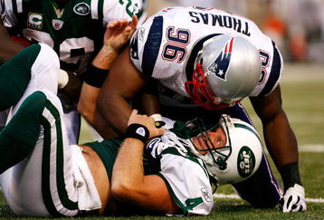 EAST RUTHERFORD, NJ - SEPTEMBER 14:  Quarterback Brett Favre #4 of the New York Jets is sacked by linebacker Adalius Thomas #96 late in the game on September 14, 2008 at Giants Stadium in East Rutherford, New Jersey. New England won 19-10.  (Photo by Jarrett Baker/Getty Images)