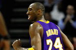 CHARLOTTE, NC - MARCH 31:  Kobe Bryant #24 of the Los Angeles Lakers sticks out his tounge at Michael Jordan as he runs down the court during their game against the Charlotte Bobcats at Time Warner Cable Arena on March 31, 2009 in Charlotte, North Carolina.  NOTE TO USER: User expressly acknowledges and agrees that, by downloading and/or using this Photograph, user is consenting to the terms and conditions of the Getty Images License Agreement.  (Photo by Streeter Lecka/Getty Images)
