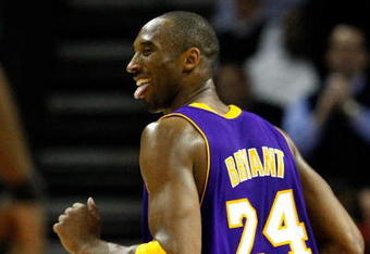 CHARLOTTE, NC - MARCH 31:  Kobe Bryant #24 of the Los Angeles Lakers sticks out his tounge at Michael Jordan as he runs down the court during their game against the Charlotte Bobcats at Time Warner Cable Arena on March 31, 2009 in Charlotte, North Carolina.  NOTE TO USER: User expressly acknowledges and agrees that, by downloading and/or using this Photograph, user is consenting to the terms and conditions of the Getty Images License Agreement.  (Photo by Streeter Lecka/Getty Images)