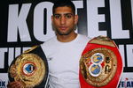 LONDON, ENGLAND - APRIL 22:  Amir Khan  poses with his belts at the press conference prior to his forthcoming WBA Light-welterweight fight against Andreas Kotelnik of the Ukraine at O2 Arena on April 22, 2009 in London, England.  (Photo by John Gichigi/Getty Images)