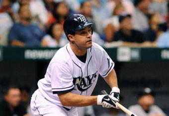 ST. PETERSBURG, FL - APRIL 15: Designed hitter Pat Burrell #5 of the Tampa Bay Rays bats against the New York Yankees at Tropicana Field on April 15, 2009 in St. Petersburg, Florida. All Major League Baseball players are wearing #42 in honor of Jackie Robinson day. (Photo by Al Messerschmidt/Getty Images)