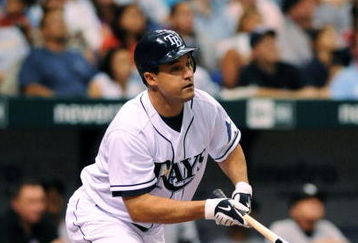 ST. PETERSBURG, FL - APRIL 15: Designed hitter Pat Burrell #5 of the Tampa Bay Rays bats against the New York Yankees at Tropicana Field on April 15, 2009 in St. Petersburg, Florida. All Major League Baseball players are wearing #42 in honor of Jackie Robinson day. (Photo by Al Messerschmidt/Getty Images)