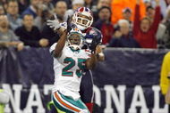TORONTO, ON - DECEMBER 07:  Will Allen #25 of the Miami Dolphins looks for the reception against Lee Evans #83 of the Buffalo Bills on December 7, 2008 at Rogers Centre in Toronto, Ontario, Canada. The Dolphins won 16-3. (Photo by Rick Stewart/Getty Images)