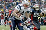 ORCHARD PARK, NY - DECEMBER 28: Heath Evans #44 of the New England Patriots runs after a catch for 12 yards as Ko Simpson #30 of the Buffalo Bills  makes the tackle at Ralph Wilson Stadium on December 28, 2008 in Orchard Park, New York. The Patriots won 13-0.  (Photo by Rick Stewart/Getty Images)