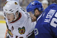 VANCOUVER, CANADA - MAY 9: Jonathan Toews #19 of the Chicago Blackhawks faces off against Henrik Sedin #33 of the Vancouver Canucks during Game Five of the Western Conference Semifinals of the 2009 Stanley Cup Playoffs on May 09, 2009 at General Motors Place in Vancouver, British Columbia, Canada. (Photo by Nick Didlick/Getty Images)