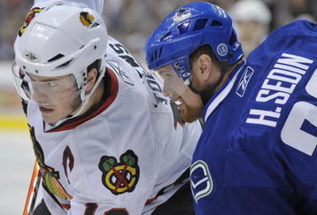 VANCOUVER, CANADA - MAY 9: Jonathan Toews #19 of the Chicago Blackhawks faces off against Henrik Sedin #33 of the Vancouver Canucks during Game Five of the Western Conference Semifinals of the 2009 Stanley Cup Playoffs on May 09, 2009 at General Motors Place in Vancouver, British Columbia, Canada.  (Photo by Nick Didlick/Getty Images)