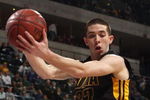 INDIANAPOLIS - MARCH 12:  Jake Kelly #32 of the Iowa Hawkeyes grabs a rebound against the Michigan Wolveriens during the first round of the Big Ten Men's Basketball Tournament at Conseco Fieldhouse on March 12, 2009 in Indianapolis, Indiana.  (Photo by Jonathan Daniel/Getty Images)