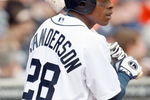 DETROIT - APRIL 10:  Curtis Granderson #28 of the Detroit Tigers warms up ondeck against the Texas Rangers during Opening Day on April 10, 2009 at Comerica Park in Detroit, Michigan. Detroit won the game 15-2. (Photo by Gregory Shamus/Getty Images)