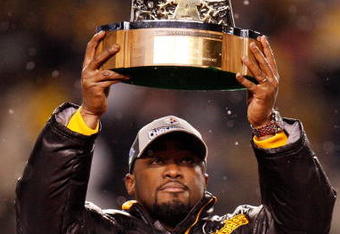 PITTSBURGH - JANUARY 18:  Mike Tomlin head coach of the Pittsburgh Steelers holds up the Lamar Hunt AFC championship trophy after defeating the Baltimore Ravens 23-14 during the AFC championship game on January 18, 2009 at Heinz Field in Pittsburgh, Pennsylvania.  (Photo by Gregory Shamus/Getty Images)