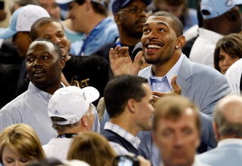 DETROIT - APRIL 06:  (R) Julius Peppers of the NFL's Carolina Panthers and a former North Carolina Tar Heels basketball player cheers on the Tar Heels during the game against the Michigan State Spartans during the 2009 NCAA Division I Men's Basketball National Championship game at Ford Field on April 6, 2009 in Detroit, Michigan. The Tar Heels defeated the Spartans 89-72. (Photo by Streeter Lecka/Getty Images)