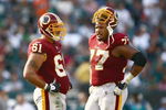 PHILADELPHIA - OCTOBER 05:  Casey Rabach #61 and  Randy Thomas #77 of the Washington Redskins rest on the field against the Philadelphia Eagles on October 5, 2008 at Lincoln Financial Field in Philadelphia, Pennsylvania. (Photo by Chris McGrath/Getty Images)