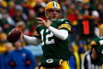 GREEN BAY, WI - DECEMBER 07:  Quarterback Aaron Rodgers #12 of the Green Bay Packers drops back to pass against the Houston Texans during the first quarter at Lambeau Field on December 7, 2008 in Green Bay, Wisconsin. The Texans defeated the Packers 24-21.  (Photo by Jeff Gross/Getty Images)