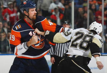 UNIONDALE, NY - NOVEMBER 26:  Mitch Fritz #49 of the New York Islanders fights with Eric Godard #28 of the Pittsburgh Penguins during their NHL game on November 26, 2008 at the Nassau Coliseum in Uniondale, New York.  The Penguins defeated the Islanders 5-3.  (Photo by Bruce Bennett/Getty Images)