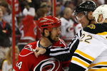 RALEIGH, NC - MAY 06:  Shawn Thornton #22 of the Boston Bruins is held back from Scott Walker #24 of the Carolina Hurricanes during Game Three of the Eastern Conference Semifinals at RBC Center on May 6, 2009 in Raleigh, North Carolina.  (Photo by Streeter Lecka/Getty Images)