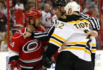 RALEIGH, NC - MAY 06:  Shawn Thornton #22 of the Boston Bruins is held back from Scott Walker #24 of the Carolina Hurricanes during Game Three of the Eastern Conference Semifinals at RBC Center on May 6, 2009 in Raleigh, North Carolina.  (Photo by Streeter Lecka/Getty Images)