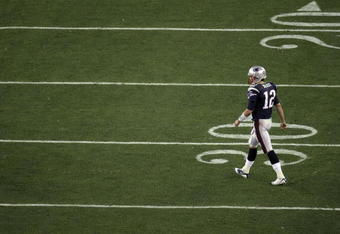 GLENDALE, AZ - FEBRUARY 03:  Tom Brady #12 of the New England Patriots walks towards the the sideline against the New York Giants during Super Bowl XLII on February 3, 2008 at the University of Phoenix Stadium in Glendale, Arizona. The Giants won 17-14.  (Photo by Doug Pensinger/Getty Images)
